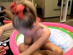 Showing of with my big boobs in inflatable pool