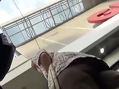 Stupid MILF in flyin' dress exposes her big juicy cellulite ass to everyone