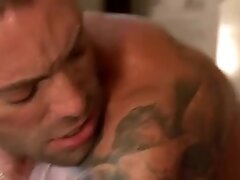 Muscular biker fucks a gay hunk in the arse